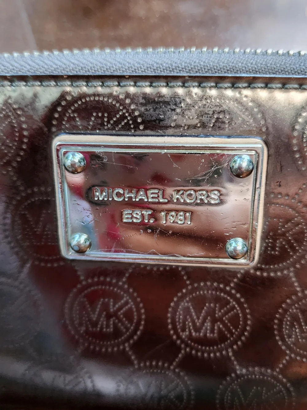 Michael Kors Metallic Pewter Monogram Embossed Zip Around Wallet